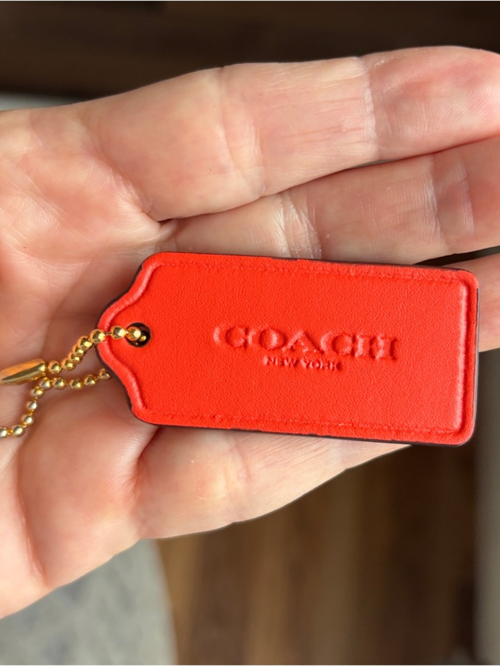 Coach Orange Smooth Leather hang Tag Keychain with Gold Chain